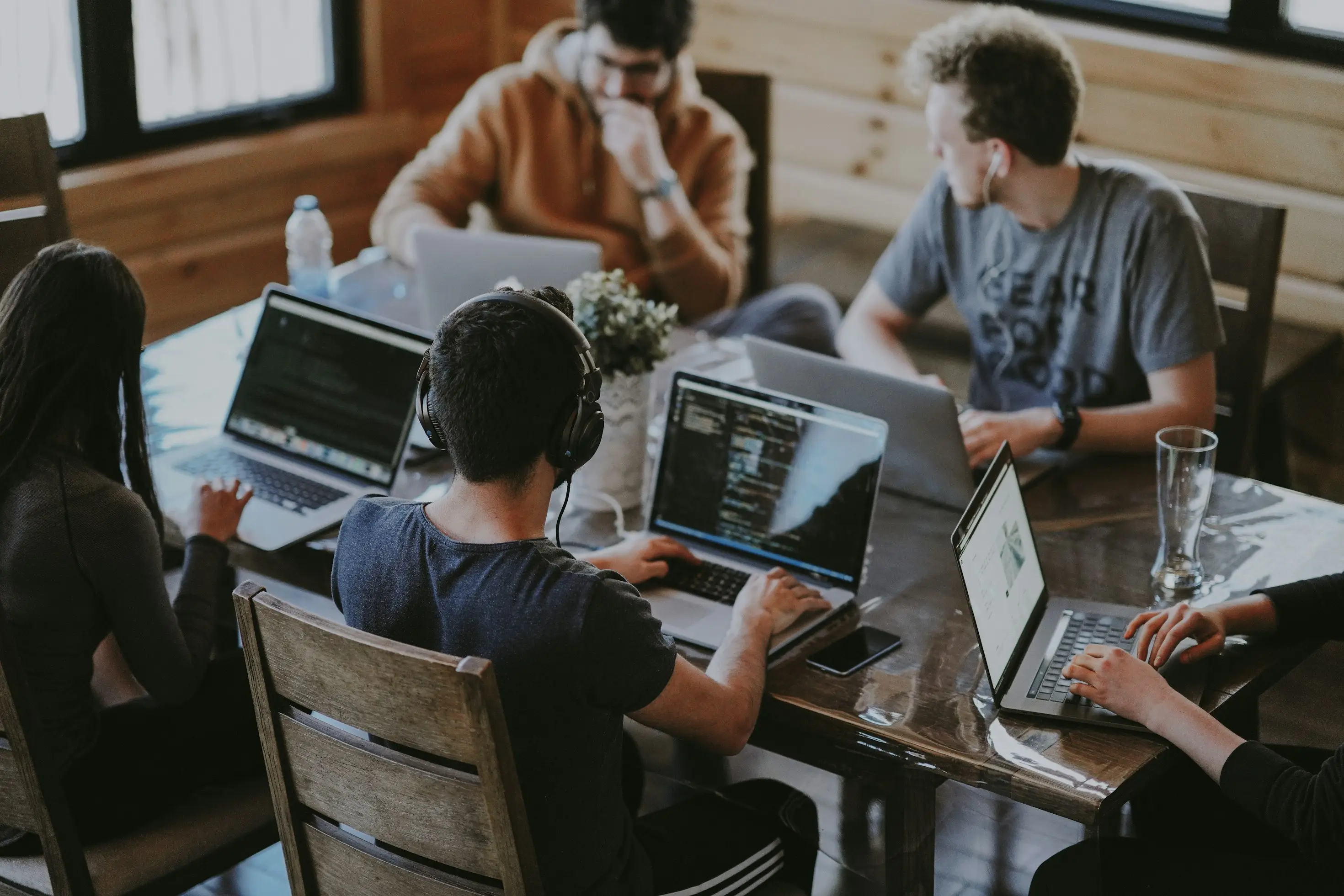 Procedo team members collaborating on AI solutions in a modern tech workspace