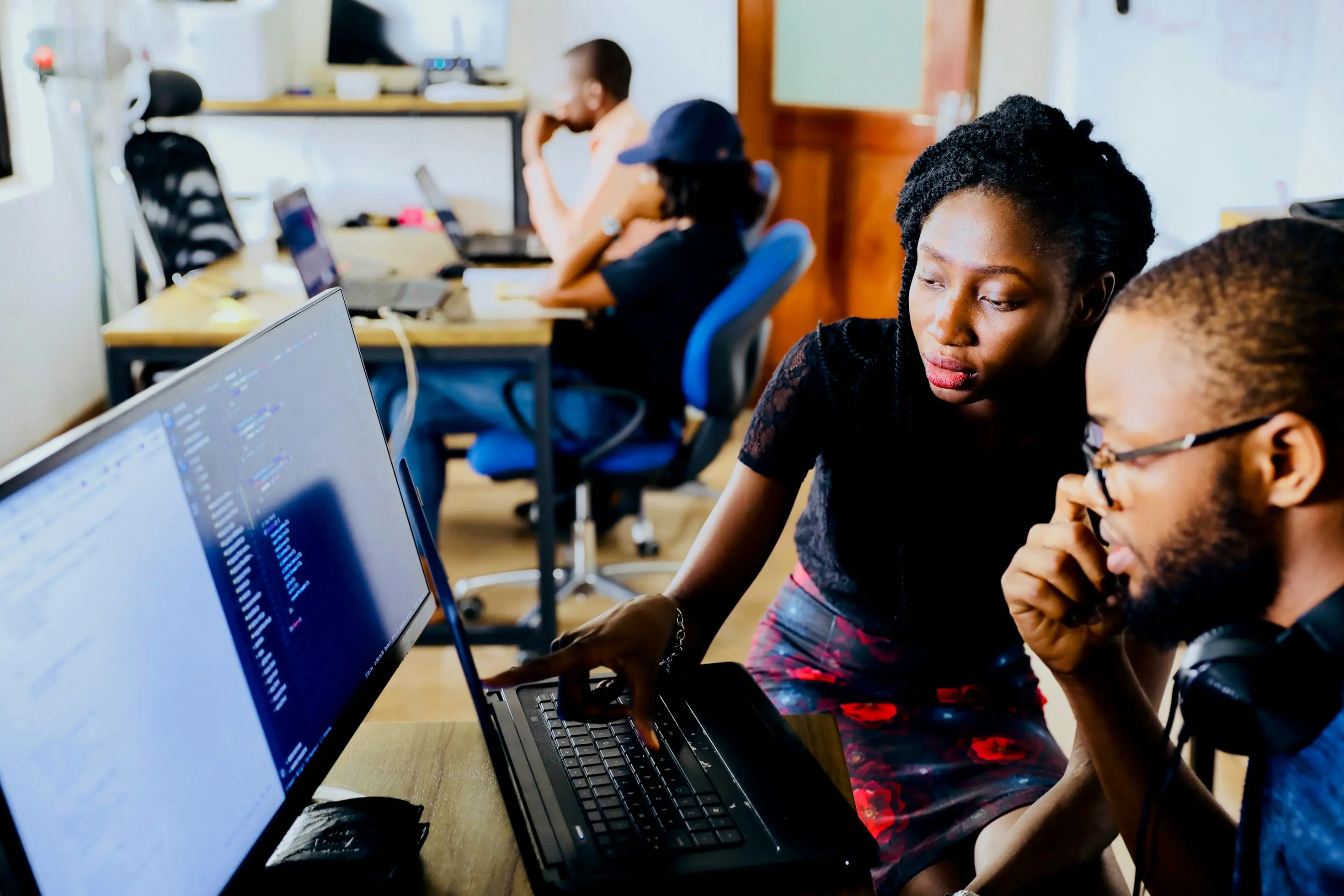 Diverse tech team working together on innovative industrial AI solutions